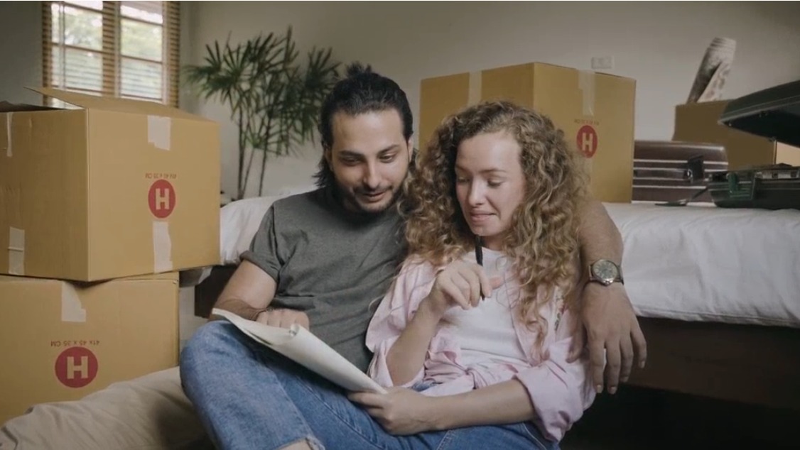 A couple reviewing paperwork together at home